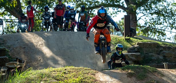 Rider with arms out on course